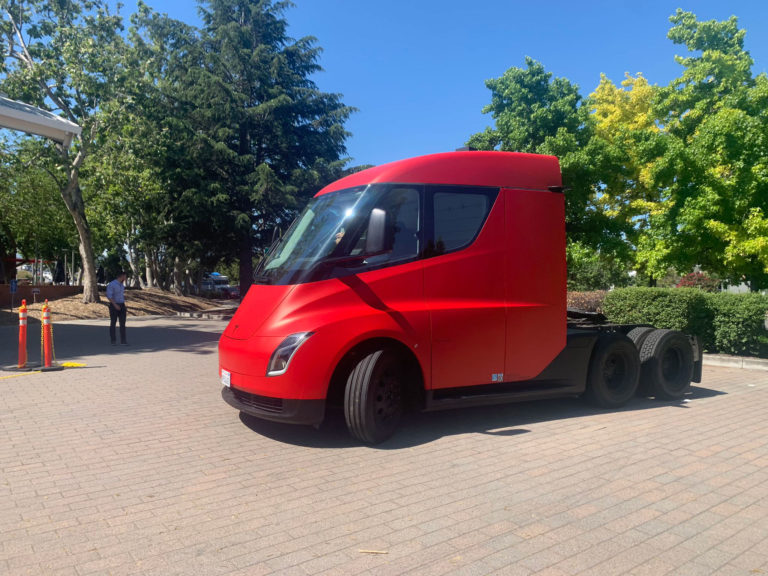 Red Tesla Semi, Roadster, and Model Y greet the participants at the ...